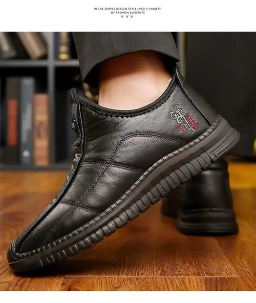 Men's winter waterproof non-slip platform work boots by MANDOTOS INTERNATIONAL, size 38-48, showing sturdy sole and waterproof leather upper.