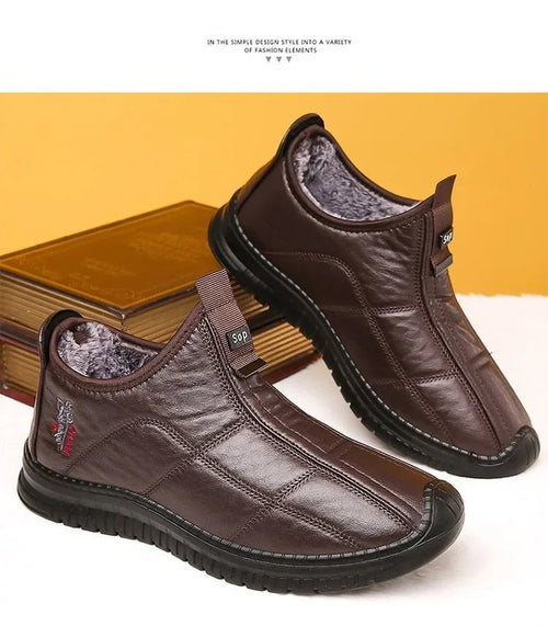 Men's winter waterproof non-slip platform work boots by MANDOTOS INTERNATIONAL, size 38-48, showing sturdy leather upper and rugged sole.