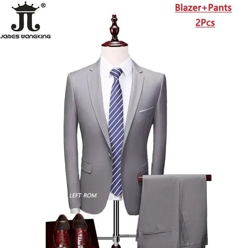 Men's 3-piece business suit set by MANDOTOS INTERNATIONAL featuring jacket, vest, and pants in various sizes and colors.