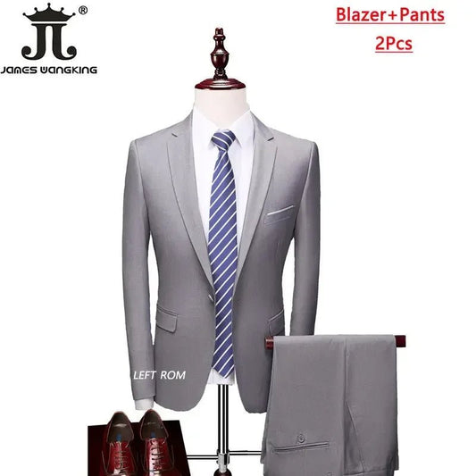 Men's 3-piece business suit set by MANDOTOS INTERNATIONAL featuring jacket, vest, and pants in various sizes and colors.