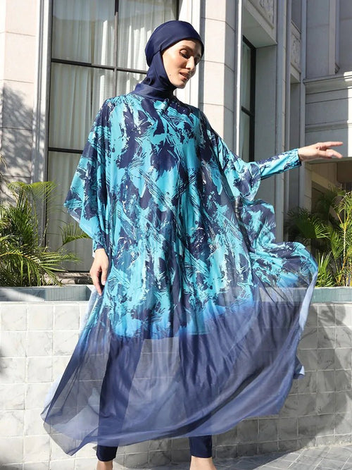 Mandotos International modest coverage Muslim burkini with stylish design, full-body swimwear for middle-aged women, shown on a woman at the beach.