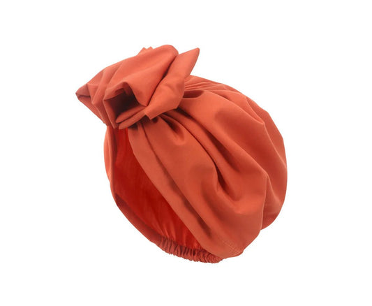 Muslim-style mirror hats and African headgear for women by MANDOTOS INTERNATIONAL, featuring intricate mirror embellishments and vibrant designs.