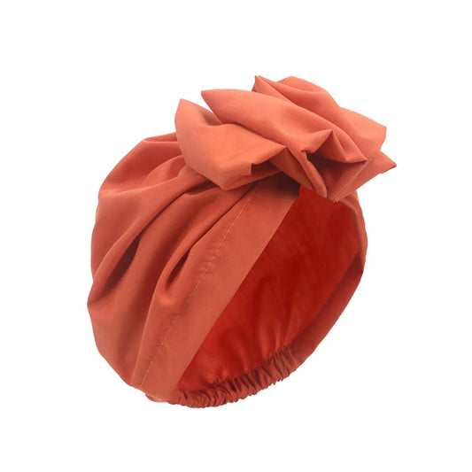 Muslim-style mirror hats and African headgear for women with intricate mirror and bead embellishments, designed by MANDOTOS INTERNATIONAL.