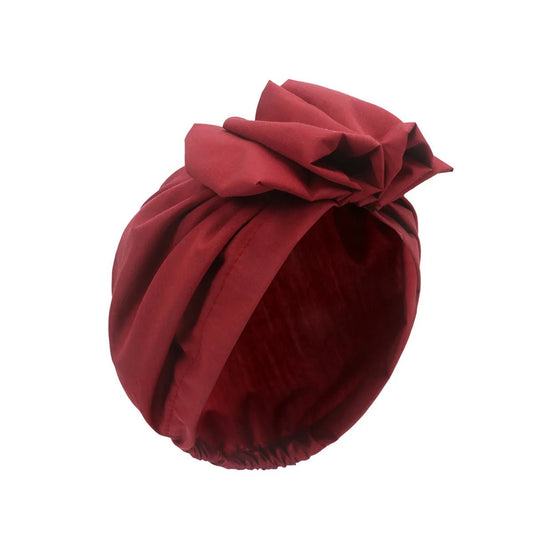 Muslim-style mirror hats and African headgear for women, featuring intricate designs and vibrant patterns by MANDOTOS INTERNATIONAL.