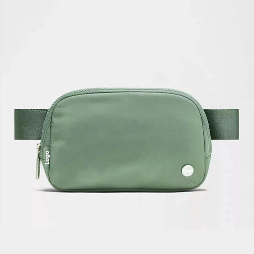 Mandotos International lightweight women’s waist bag for running and travel, shown in black with adjustable strap.
