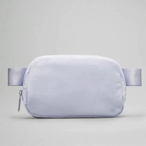 Mandotos International lightweight women’s waist bag for running and travel, with adjustable strap and secure zipper closure.