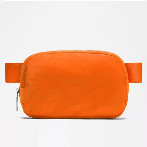Mandotos International premium lightweight women's waist bag for running and travel, shown in black with adjustable strap.