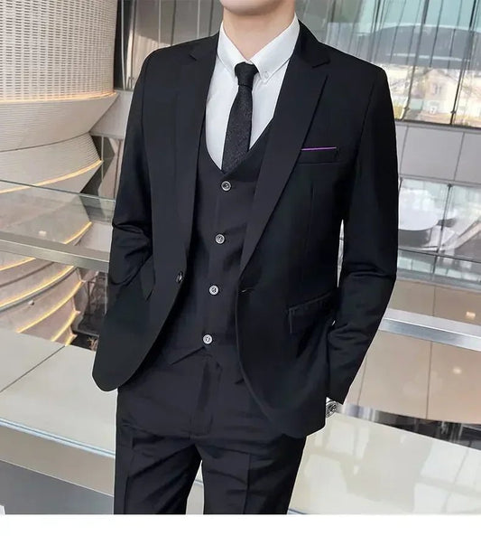 Mandotos International men's formal business suit with blazer, vest, and pants in black, styled for professional or banquet occasions.