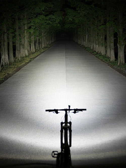 Mandotos International super bright LED bicycle front light mounted on a bike for night riding visibility and safety