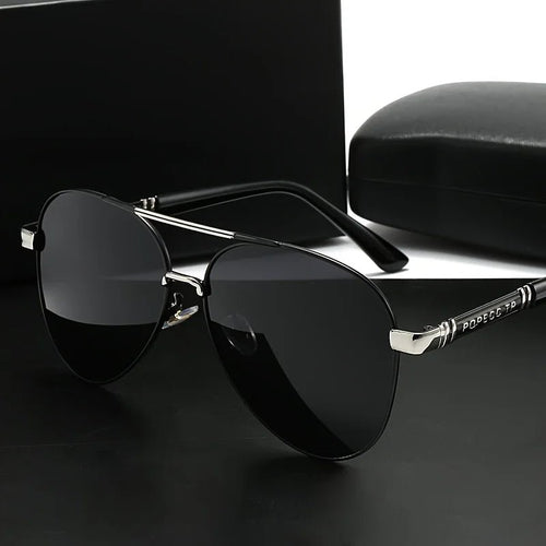Unisex polarized stylish eyewear by Mandotos International, ideal for travel and driving, with sleek frame and tinted lenses.