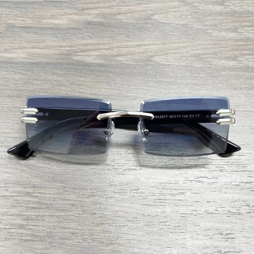 Vintage rimless sunglasses with stylish PC frames by Mandotos International, featuring sleek, modern design and clear lenses.