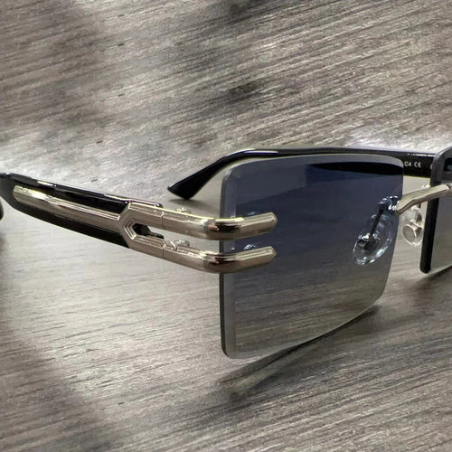 Vintage rimless sunglasses with stylish PC frames by Mandotos International, showcasing sleek and modern eyewear design.