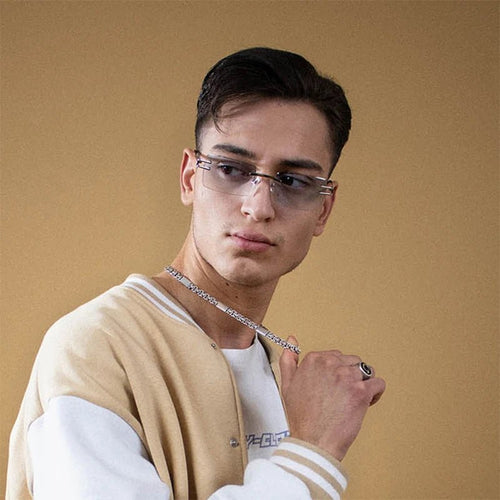 Vintage rimless sunglasses with stylish PC frames by MANDOTOS INTERNATIONAL, featuring sleek, modern design and clear lenses.