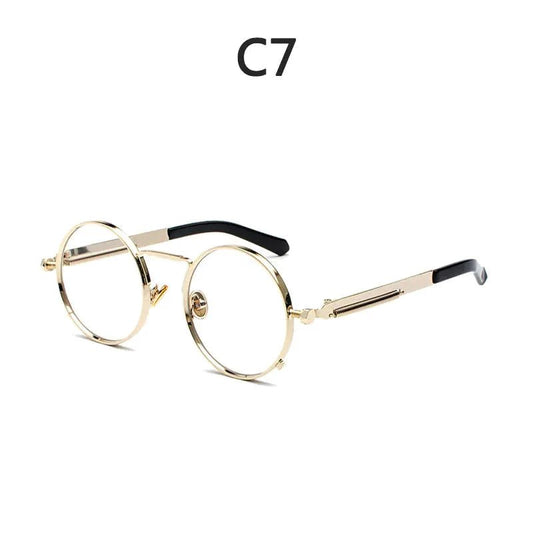 Vintage steampunk circular shades by MANDOTOS INTERNATIONAL with metal frames and tinted lenses, stylish retro eyewear.