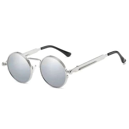 Vintage steampunk circular sunglasses by MANDOTOS INTERNATIONAL with metal frames and tinted lenses.