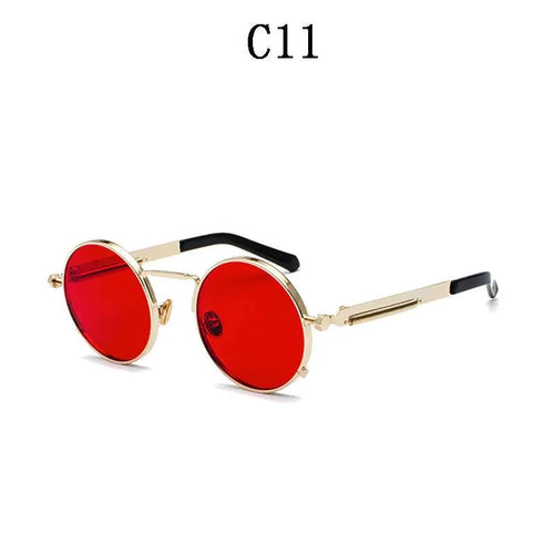 Vintage steampunk circular shades by MANDOTOS INTERNATIONAL with metal frames and tinted lenses for a retro-inspired look.