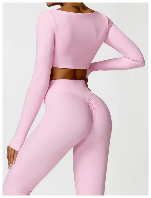 Women's long sleeve fitness T-shirt from MANDOTOS INTERNATIONAL, gym-ready push-up top for active wear.