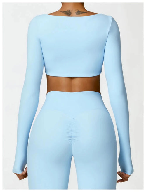 Women's long sleeve fitness T-shirt by MANDOTOS INTERNATIONAL, gym push-up top, comfortable athletic wear for women.
