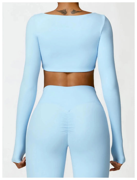 Women's long sleeve fitness T-shirt by MANDOTOS INTERNATIONAL, gym push-up top, comfortable athletic wear for women.