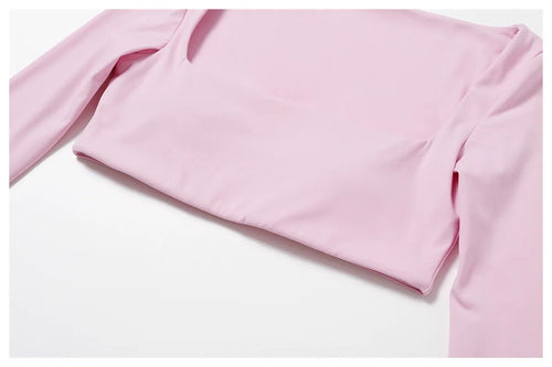 Women's long sleeve fitness T-shirt by MANDOTOS INTERNATIONAL, gym push-up top, made for active workouts and comfortable movement.