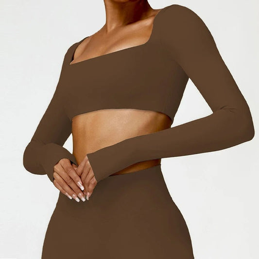 Women's long sleeve fitness T-shirt by MANDOTOS INTERNATIONAL, gym workout top with push-up design, made for active wear.