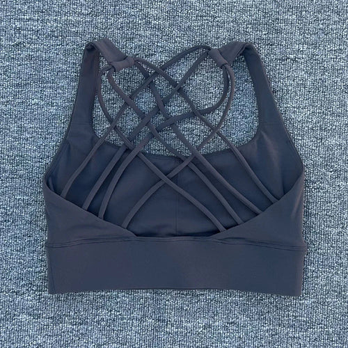 Mandotos International women's shockproof yoga crop top with anti-sweat fabric, designed for gym and sports activities.