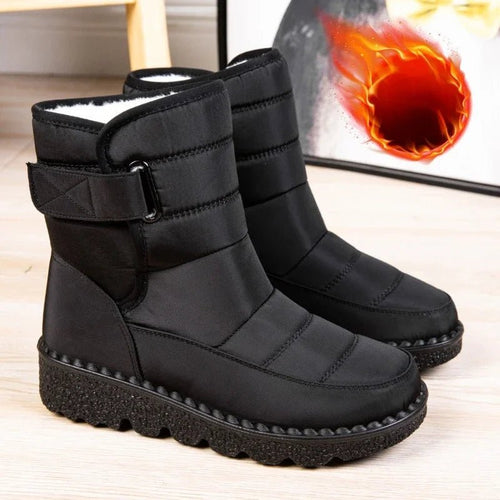 Women's waterproof winter snow boots by MANDOTOS INTERNATIONAL with non-slip soles, warm lining, and platform design.