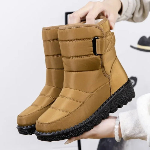 Women's waterproof winter snow boots by MANDOTOS INTERNATIONAL featuring non-slip soles, warm platform design, and ankle-high coverage.
