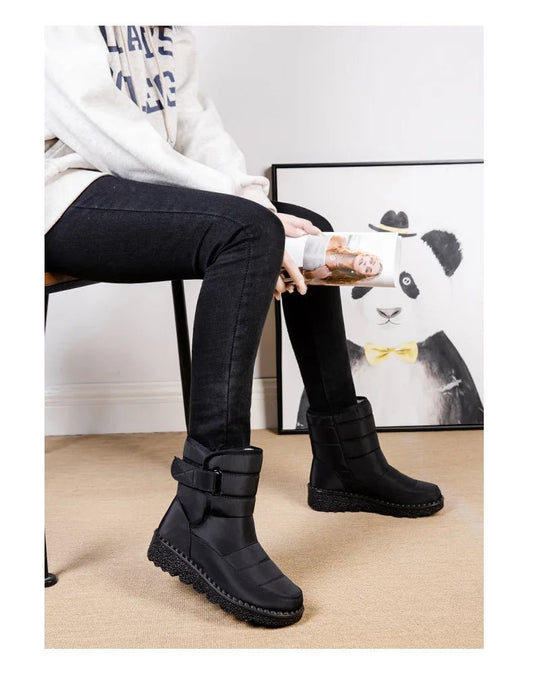Women's waterproof winter snow boots by MANDOTOS INTERNATIONAL with non-slip soles, warm insulation, and a stylish platform design.