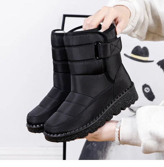 Women's waterproof winter snow boots by MANDOTOS INTERNATIONAL with non-slip soles, warm lining, and platform design.