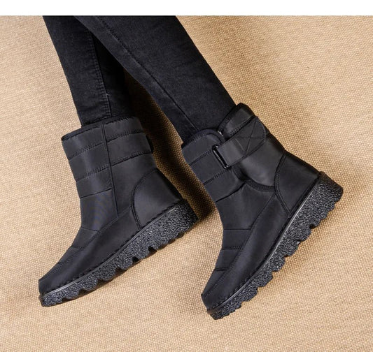 Women's waterproof winter snow boots by MANDOTOS INTERNATIONAL with non-slip soles, warm lining, and platform design.