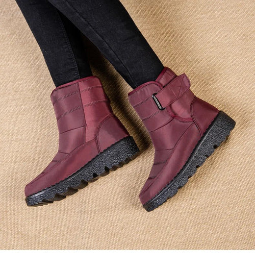 Women's waterproof winter snow boots by MANDOTOS INTERNATIONAL, non-slip ankle boots with warm platform soles, ideal for cold weather.