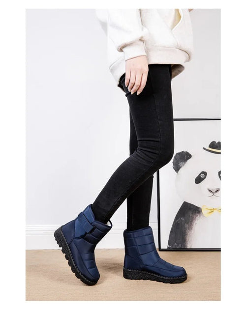Women's waterproof winter snow boots by MANDOTOS INTERNATIONAL with non-slip soles and warm platform design.