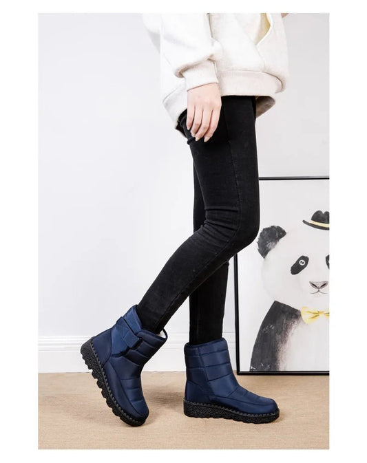 Women's waterproof winter snow boots by MANDOTOS INTERNATIONAL with non-slip soles and warm platform design.