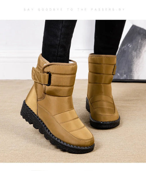 Women's waterproof winter snow boots by MANDOTOS INTERNATIONAL with non-slip soles and warm platform design, ankle-height style.