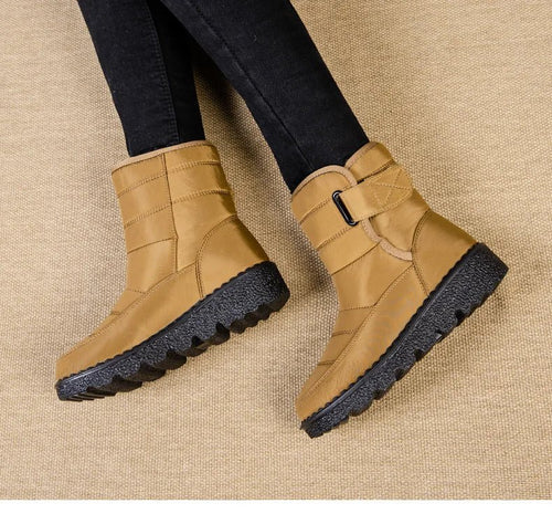 Women's waterproof winter snow boots by MANDOTOS INTERNATIONAL with non-slip soles, warm lining, and platform heel, ankle height.