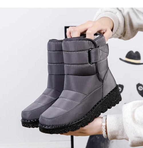 Women's waterproof winter snow boots by MANDOTOS INTERNATIONAL with non-slip soles and warm platform design.