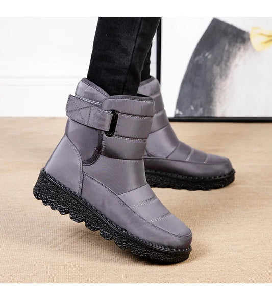 Women's waterproof winter snow boots by MANDOTOS INTERNATIONAL featuring non-slip soles, warm insulation, and stylish ankle platform design.