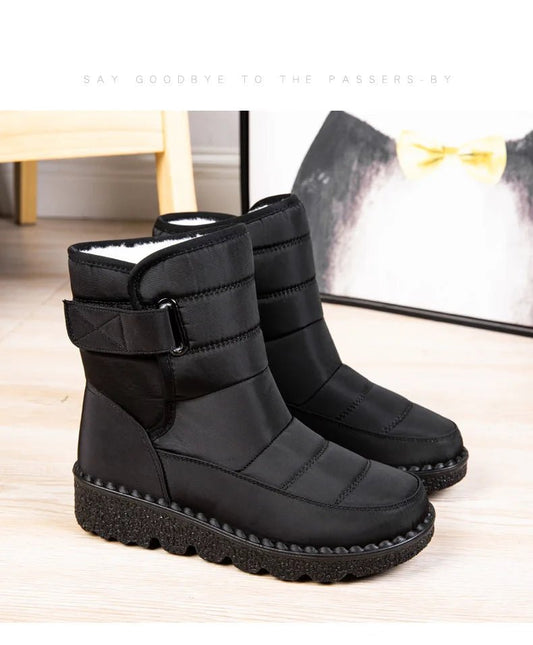 Women's waterproof winter snow boots by MANDOTOS INTERNATIONAL featuring non-slip soles and warm platform design.