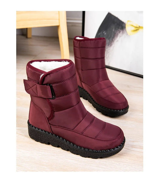 Women's waterproof winter snow boots by MANDOTOS INTERNATIONAL with non-slip soles, warm lining, ankle height, and platform design.