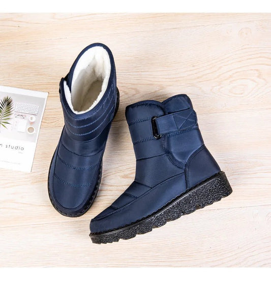 Women's waterproof winter snow boots by MANDOTOS INTERNATIONAL with non-slip soles, warm insulation, and stylish ankle platform design.