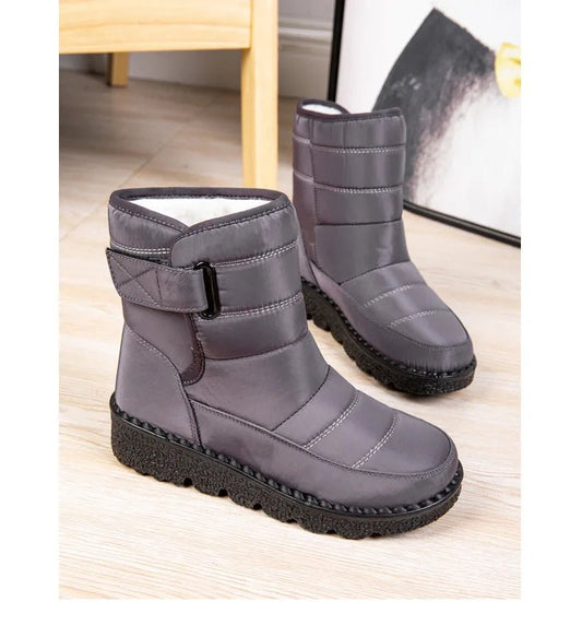 Women's waterproof winter snow boots by MANDOTOS INTERNATIONAL with non-slip soles, warm ankle platform shoes for cold weather.