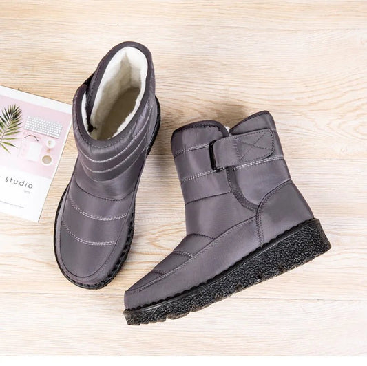 Women's waterproof winter snow boots by MANDOTOS INTERNATIONAL featuring non-slip soles, ankle height, warm lining, and platform style.