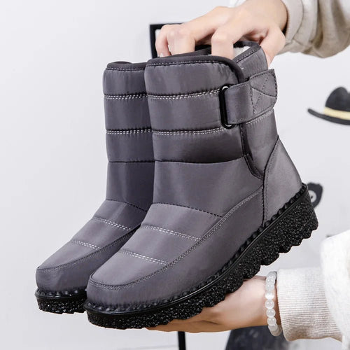 Women's waterproof winter snow boots by MANDOTOS INTERNATIONAL with non-slip soles and warm platform design.