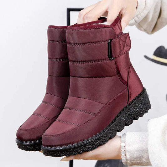 Women's waterproof winter snow boots by Mandotos International with non-slip soles, ankle height, and warm platform design.