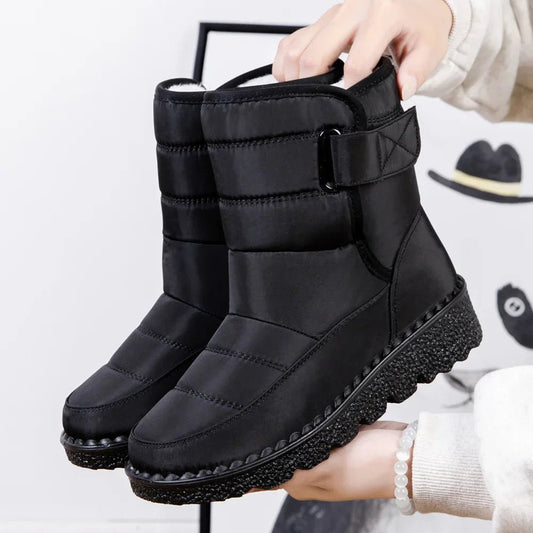 Women's waterproof winter snow boots by MANDOTOS INTERNATIONAL with non-slip soles and warm platform design, ankle height.