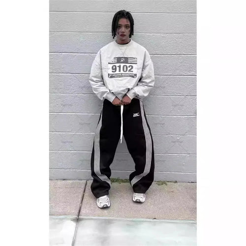 Mandotos International Y2K embroidered black gray camo tactical joggers with drawstring waistband, suitable for men and women.