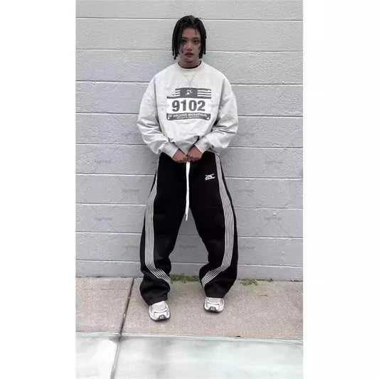 Mandotos International Y2K embroidered black gray camo tactical joggers with drawstring waistband, suitable for men and women.