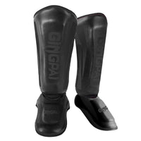 Mandotos kickboxing shin guards and Muay Thai leg protectors shown on a model, providing safety and support during training.