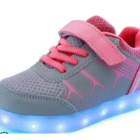 Kids luminous shoes by MANDOTOS with glowing soles and vibrant colors, perfect for active children and nighttime fun.